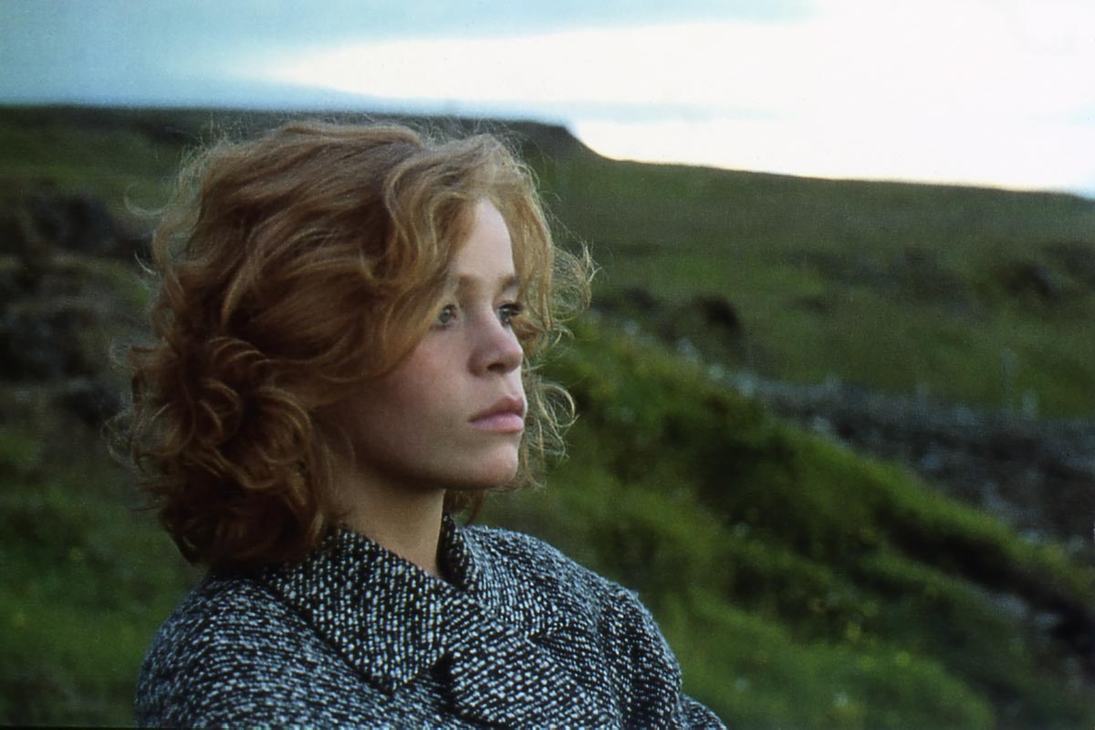 A woman is watching the sea