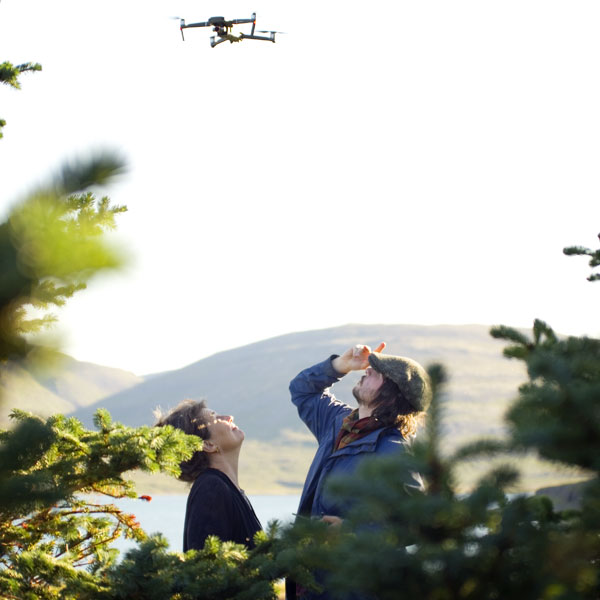 The director and the cinematographer watching the drone