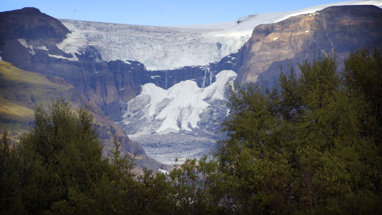 The glacier Morsárjökull with birch trees in foreground